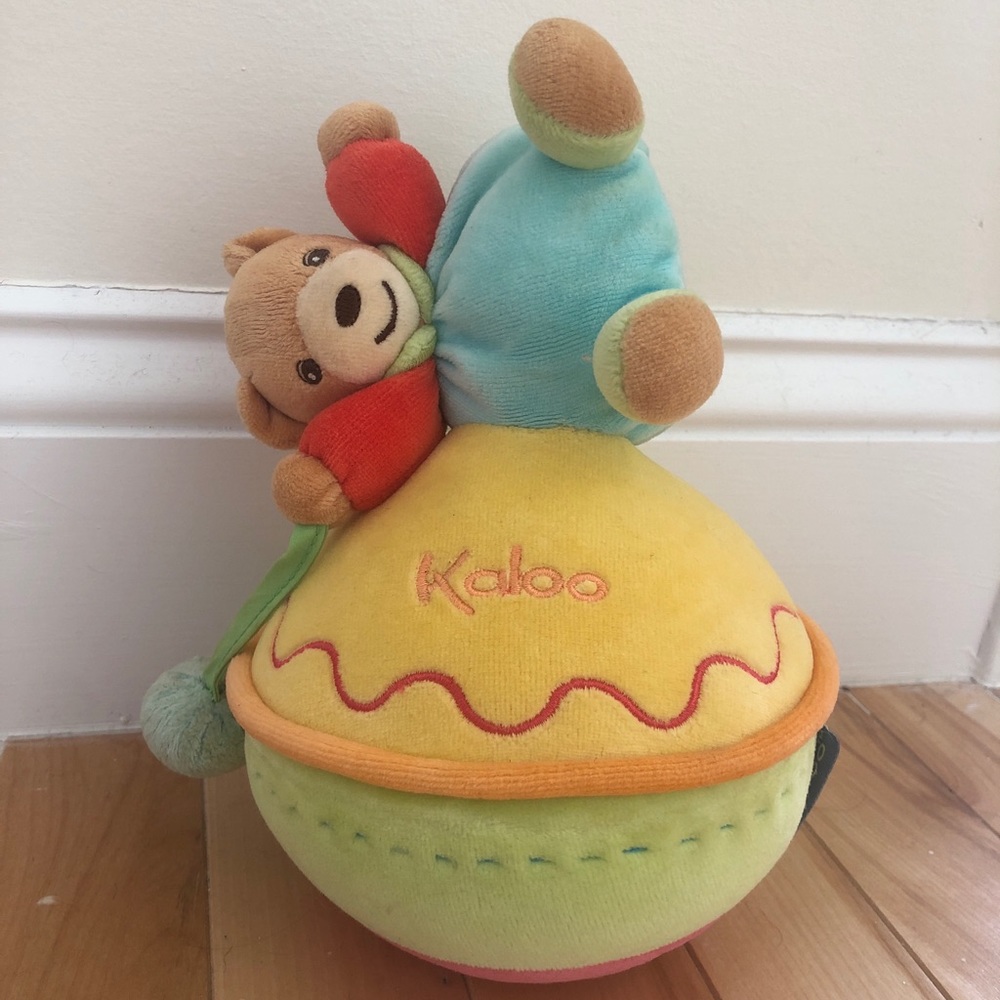 Colorful Kaloo Baby Newborn bear on top of ball that chimes when moves